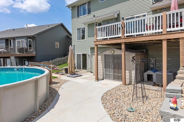 17205 Jessica Ln, Gretna, NE 68028 - outdoor pool featuring a wooden deck and a patio area