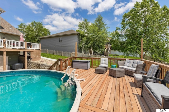 17205 Jessica Ln, Gretna, NE 68028 - view of pool with a wooden deck, an outdoor hangout area, a fenced backyard, and stairs