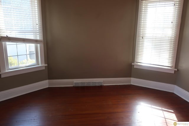 2722 N 64th St, Omaha, NE 68104 - unfurnished room with dark wood-style floors and baseboards