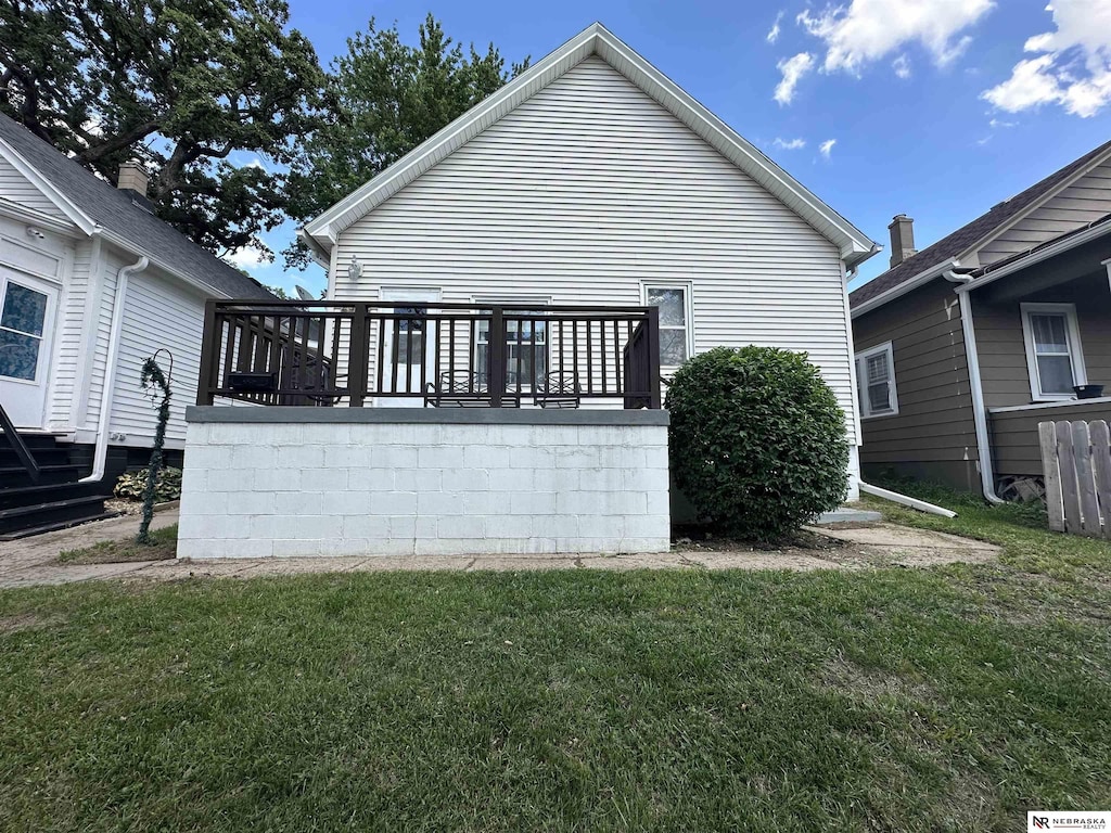 2329 S 11th St, Omaha, NE 68108 - rear view of house featuring a yard and a deck