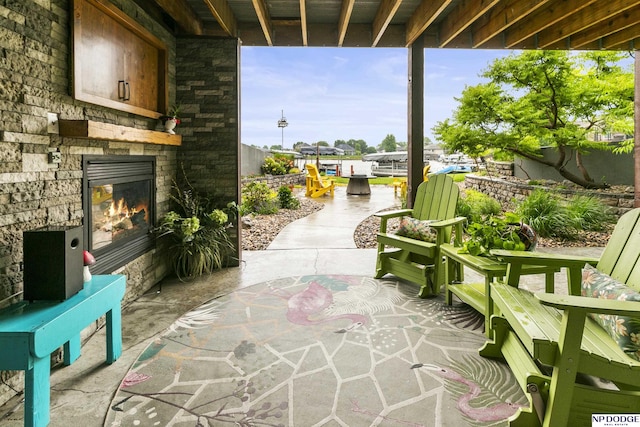 2250 Pathfinder Dr, Fremont, NE 68025 - view of patio featuring an outdoor stone fireplace