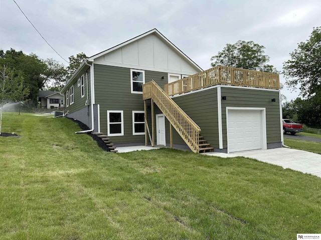 4522 N 40th St, Omaha, NE 68111 - view of front of home with stairway, board and batten siding, a front yard, a wooden deck, and concrete driveway