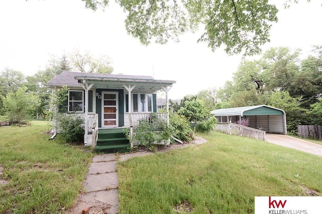90 N Montgomery St, Nelson, NE 68961 - view of front of house featuring covered porch and a carport