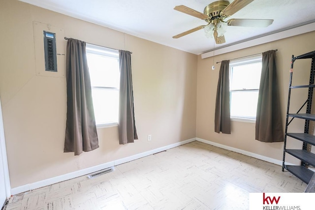 90 N Montgomery St, Nelson, NE 68961 - spare room featuring plenty of natural light, baseboards, and a ceiling fan