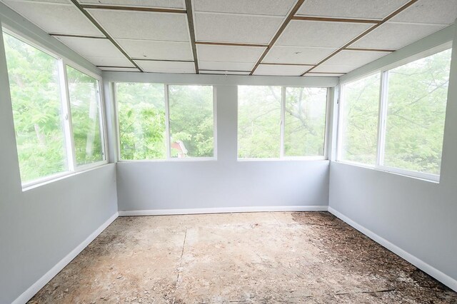 90 N Montgomery St, Nelson, NE 68961 - unfurnished sunroom featuring baseboards and plenty of natural light