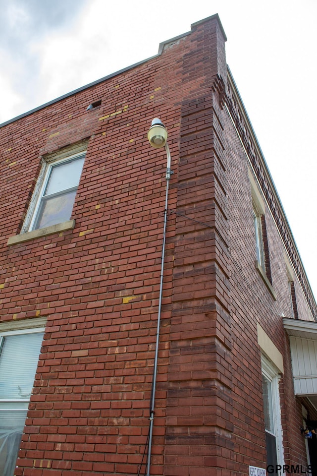 818 S 26th St, Omaha, NE 68105 - view of home's exterior featuring brick siding