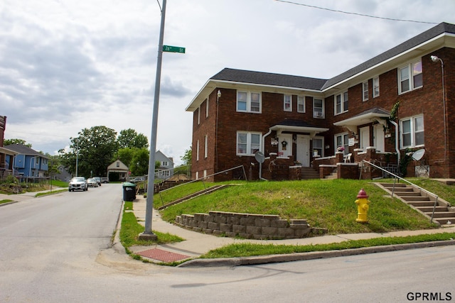 818 S 26th St, Omaha, NE 68105 - townhome / multi-family property with brick siding and a residential view