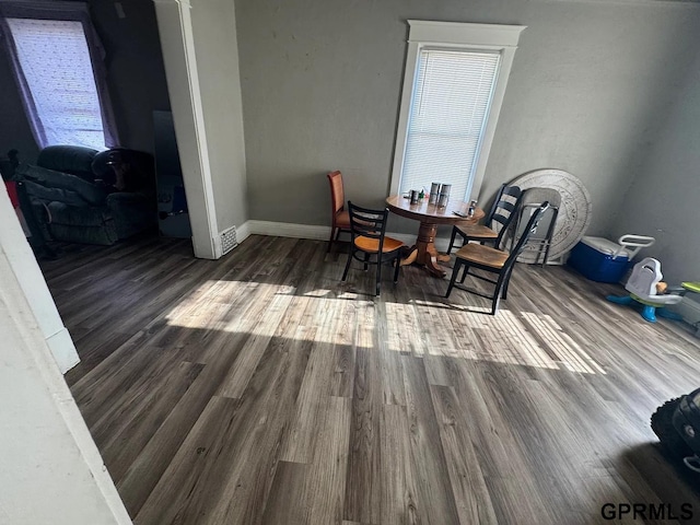 818 S 26th St, Omaha, NE 68105 - dining room featuring wood finished floors and baseboards