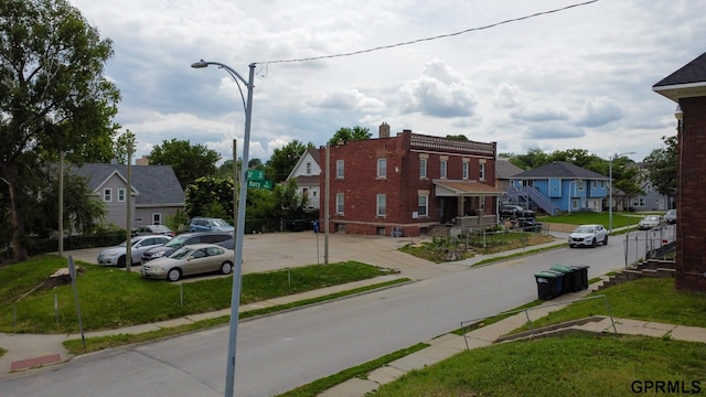 2609 Marcy St, Omaha, NE 68105 - view of asphalt street with sidewalks, street lighting, curbs, and a residential view