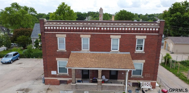 2609 Marcy St, Omaha, NE 68105 - view of property with brick siding and a shingled roof