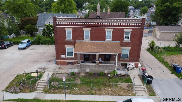 2609 Marcy St, Omaha, NE 68105 - back of property featuring brick siding and a porch