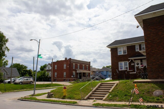 2609 Marcy St, Omaha, NE 68105 - view of building exterior featuring a residential view and stairs