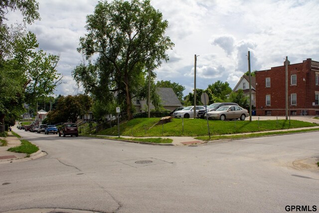 2609 Marcy St, Omaha, NE 68105 - view of asphalt street with sidewalks, curbs, and traffic signs