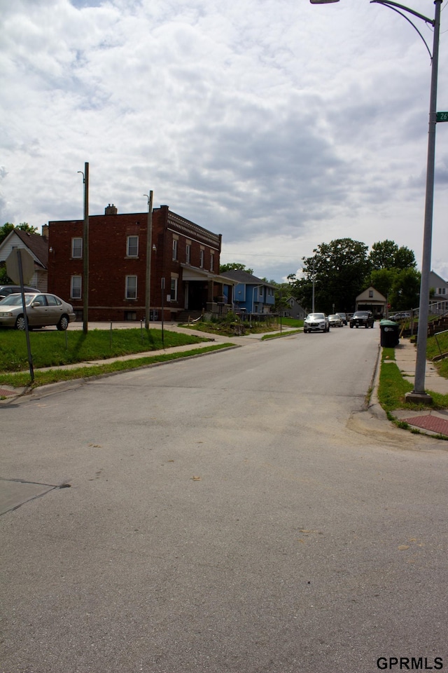 2609 Marcy St, Omaha, NE 68105 - view of asphalt street with sidewalks, curbs, and a residential view
