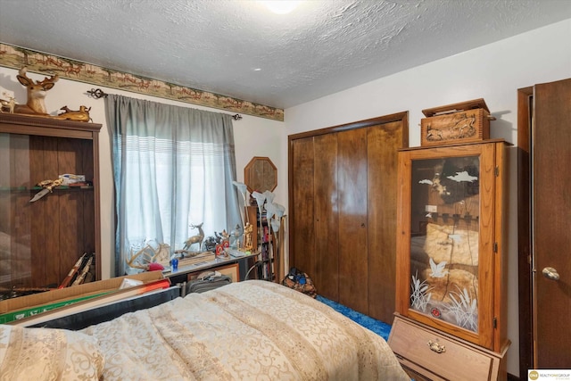 209 Carter St, Avoca, NE 68307 - bedroom featuring a closet and a textured ceiling
