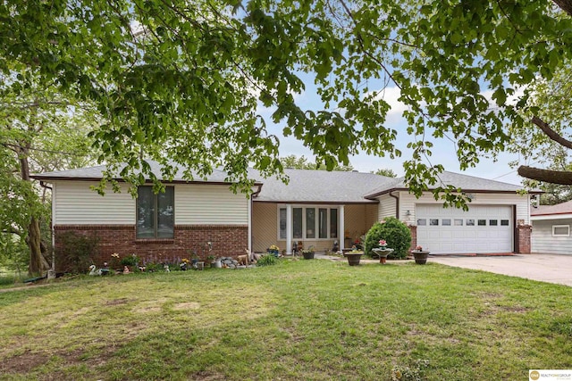 209 Carter St, Avoca, NE 68307 - single story home featuring an attached garage, brick siding, driveway, and a front yard