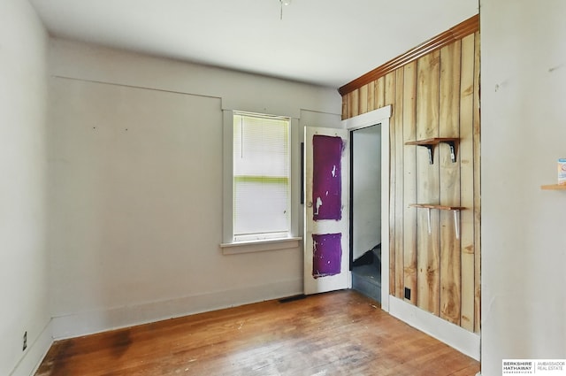 1822 N 38th St, Omaha, NE 68111 - unfurnished bedroom with wood finished floors