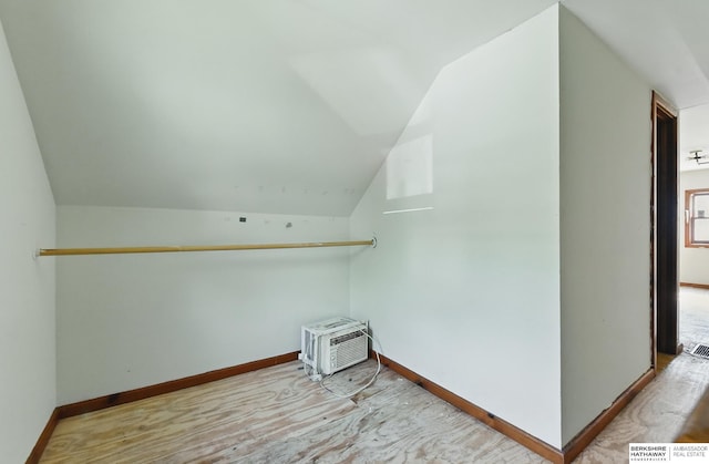 1822 N 38th St, Omaha, NE 68111 - bonus room featuring lofted ceiling, wood finished floors, and baseboards