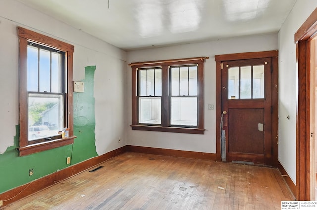 1822 N 38th St, Omaha, NE 68111 - foyer featuring wood-type flooring, plenty of natural light, and baseboards