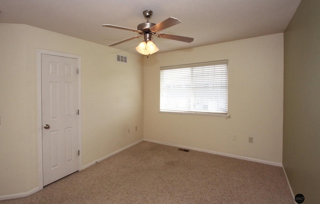 6028 Glenbrook Ln, Lincoln, NE 68512 - carpeted spare room featuring a ceiling fan and baseboards