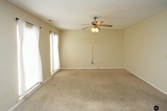 6028 Glenbrook Ln, Lincoln, NE 68512 - empty room featuring a ceiling fan, carpet floors, and baseboards