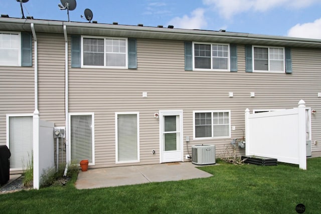 6028 Glenbrook Ln, Lincoln, NE 68512 - rear view of house featuring a yard, central air condition unit, and a patio
