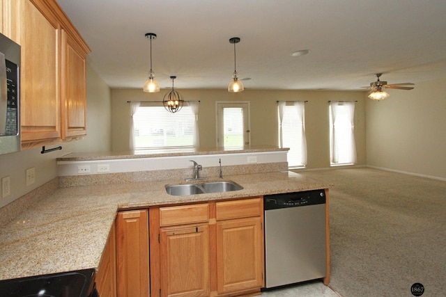 6028 Glenbrook Ln, Lincoln, NE 68512 - kitchen with stainless steel dishwasher, a sink, a peninsula, ceiling fan, and pendant lighting