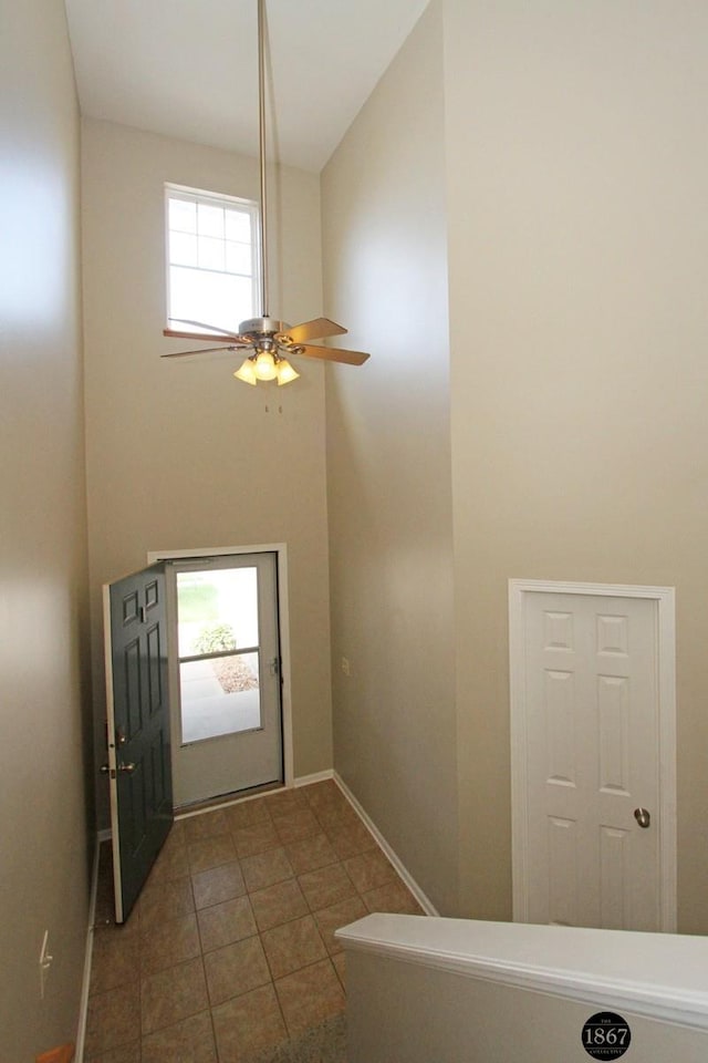 6028 Glenbrook Ln, Lincoln, NE 68512 - tiled foyer with baseboards and ceiling fan