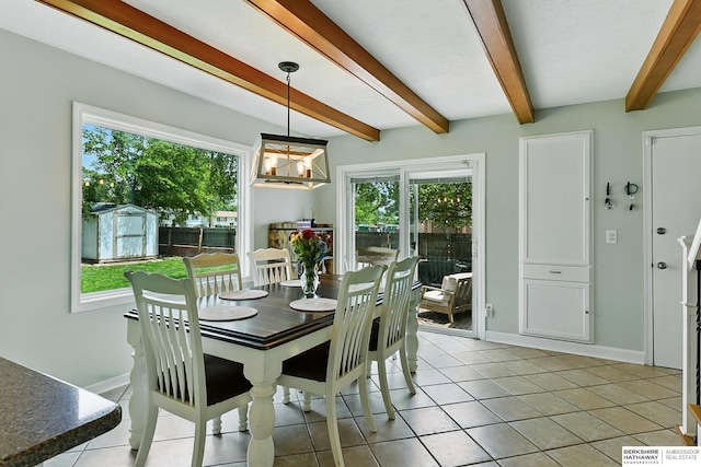 9704 Erskine St, Omaha, NE 68134 - dining area featuring plenty of natural light, beam ceiling, a chandelier, and light tile patterned flooring