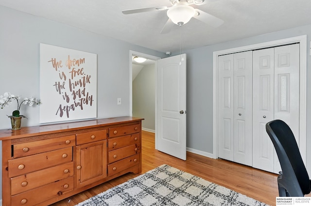 9704 Erskine St, Omaha, NE 68134 - bedroom with light wood-style flooring, a closet, and a ceiling fan