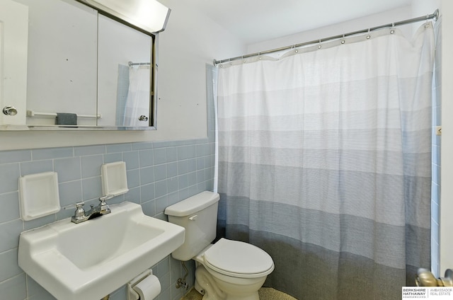 9704 Erskine St, Omaha, NE 68134 - bathroom featuring tile walls and a shower with shower curtain