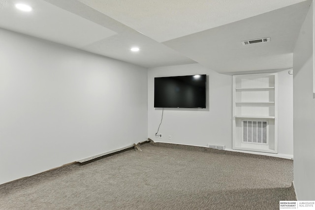 9704 Erskine St, Omaha, NE 68134 - unfurnished living room featuring recessed lighting, carpet floors, and built in shelves