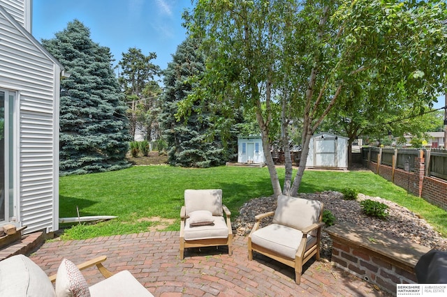 9704 Erskine St, Omaha, NE 68134 - fenced backyard featuring a storage shed and a patio area