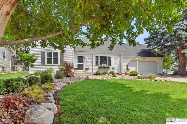 9704 Erskine St, Omaha, NE 68134 - view of front of home with a front yard, an attached garage, driveway, and a shingled roof