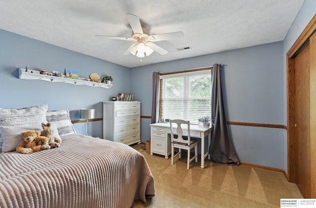 2468 N 148th St, Omaha, NE 68116 - bedroom with light carpet, a closet, a ceiling fan, baseboards, and a textured ceiling