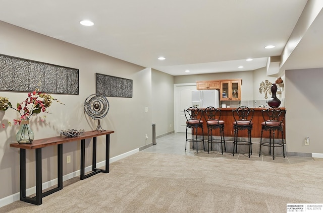 2468 N 148th St, Omaha, NE 68116 - indoor bar featuring white refrigerator with ice dispenser, recessed lighting, light colored carpet, and baseboards