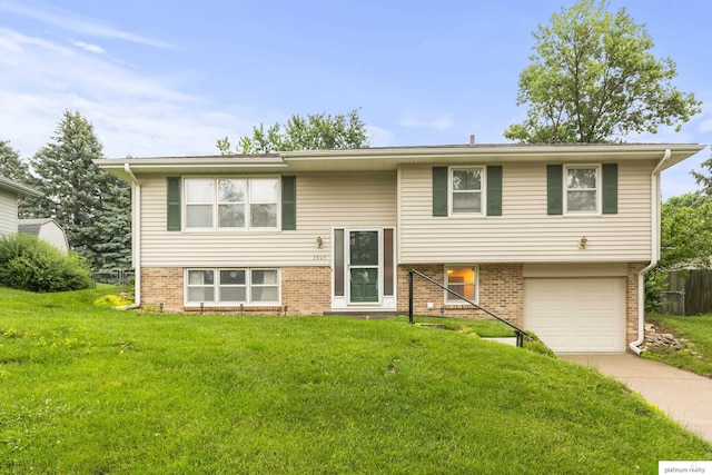 3809 N 94th St, Omaha, NE 68134 - split foyer home featuring an attached garage, a front lawn, and driveway