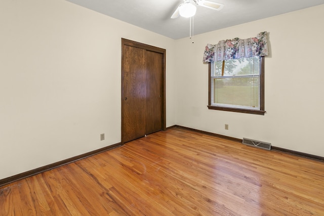 3809 N 94th St, Omaha, NE 68134 - unfurnished bedroom featuring baseboards, light wood-style flooring, a closet, and ceiling fan