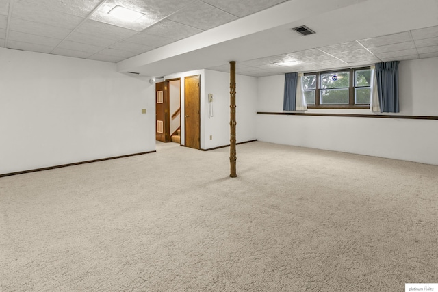 3809 N 94th St, Omaha, NE 68134 - below grade area featuring a drop ceiling, stairway, and carpet floors