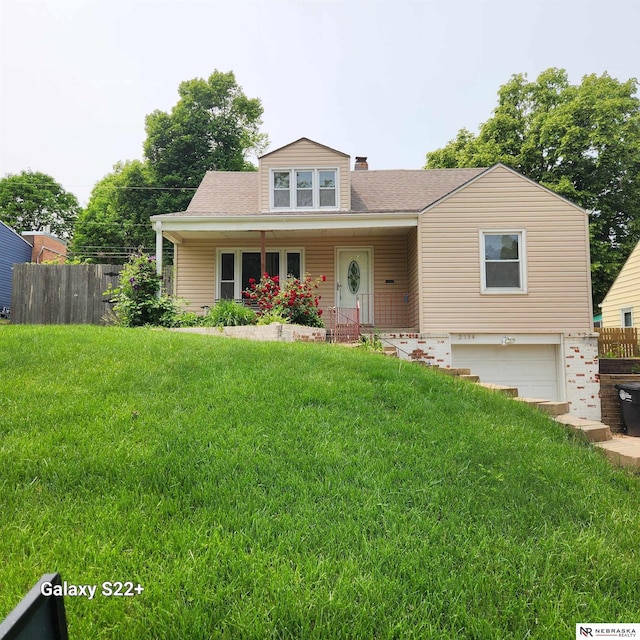 2134 S 48th St, Omaha, NE 68106 - view of front of home featuring an attached garage, covered porch, and roof with shingles