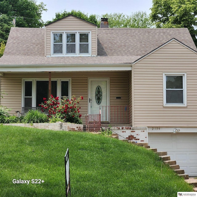 2134 S 48th St, Omaha, NE 68106 - view of front of house with a garage, a front lawn, and roof with shingles