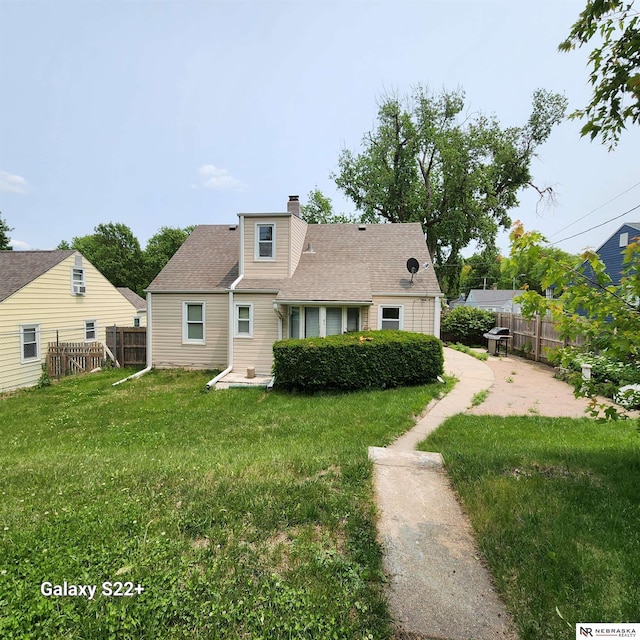 2134 S 48th St, Omaha, NE 68106 - view of front of home featuring a chimney and roof with shingles