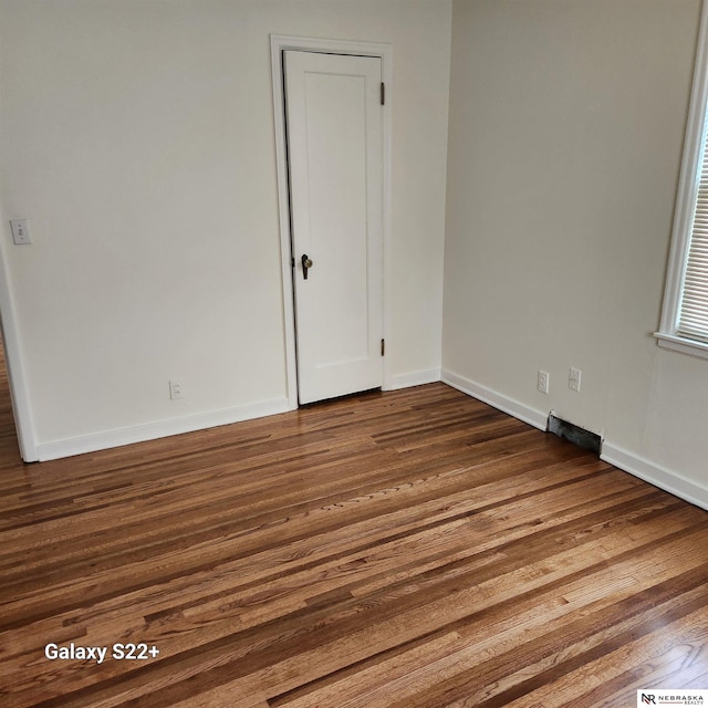 2134 S 48th St, Omaha, NE 68106 - spare room with dark wood finished floors and baseboards