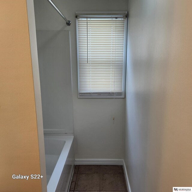 2134 S 48th St, Omaha, NE 68106 - bathroom featuring baseboards, tile patterned flooring, a shower, and a bath
