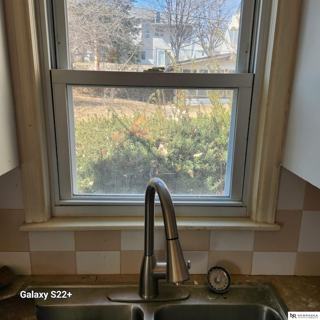 2134 S 48th St, Omaha, NE 68106 - kitchen view of a sink and decorative backsplash