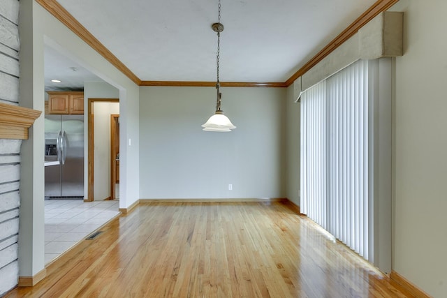337 N 91st St, Omaha, NE 68114 - unfurnished dining area featuring crown molding, plenty of natural light, light wood finished floors, and baseboards