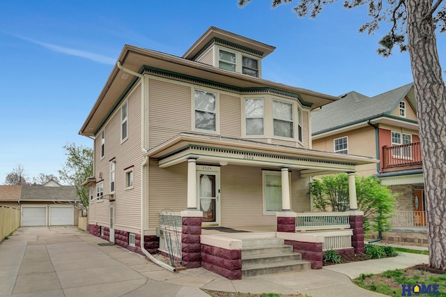 2524 S St, Lincoln, NE 68503 - traditional style home with a porch, an outdoor structure, and a garage