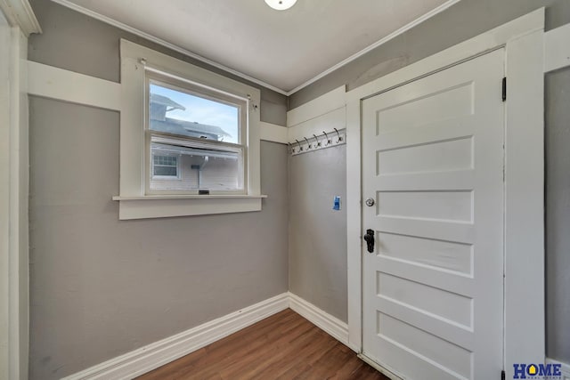 2524 S St, Lincoln, NE 68503 - entryway featuring baseboards, dark wood-style floors, and crown molding