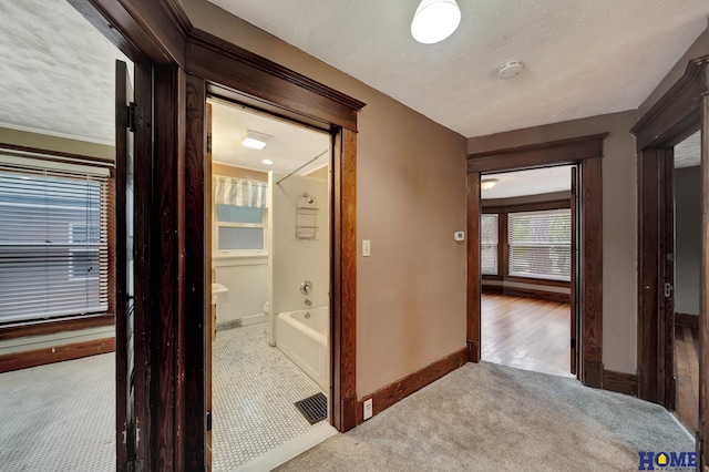 2524 S St, Lincoln, NE 68503 - hallway featuring carpet floors, baseboards, and a textured ceiling