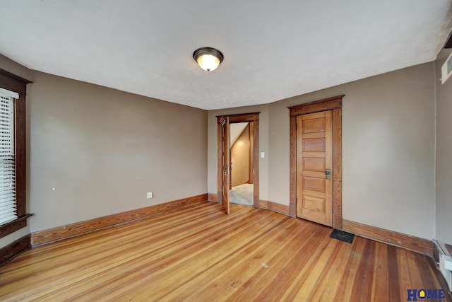 2524 S St, Lincoln, NE 68503 - spare room with baseboards and light wood-style floors